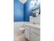 Clean bathroom with white vanity, toilet, and a stylish mirror at 1088 Laurelwood Ln, Greenwood, IN 46142