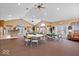 Spacious community room with tables and chairs, perfect for gatherings at 1088 Laurelwood Ln, Greenwood, IN 46142