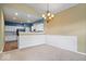 Bright dining area with a chandelier and open view to the kitchen at 1088 Laurelwood Ln, Greenwood, IN 46142