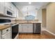 Modern kitchen featuring white cabinets, stainless steel appliances, and granite countertops at 1088 Laurelwood Ln, Greenwood, IN 46142