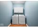 Convenient laundry room with washer, dryer, and overhead cabinets at 1088 Laurelwood Ln, Greenwood, IN 46142