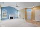 Spacious living room with vaulted ceiling, fireplace, and neutral carpeting at 1088 Laurelwood Ln, Greenwood, IN 46142