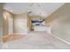 Open concept living room with kitchen views, neutral walls, and hardwood floors at 1088 Laurelwood Ln, Greenwood, IN 46142