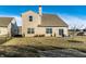 A suburban backyard with a well-maintained lawn, patio space, with a view of the street at 10917 Hunter Lake Ln, Indianapolis, IN 46239