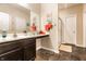 A bathroom features a dark wood vanity, a large mirror, and a stand up shower with a glass door at 10917 Hunter Lake Ln, Indianapolis, IN 46239