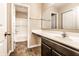 Bathroom featuring tile floors, spacious counter, and shower at 10917 Hunter Lake Ln, Indianapolis, IN 46239