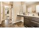 Bathroom with a large mirror, vanity, and tile flooring at 10917 Hunter Lake Ln, Indianapolis, IN 46239