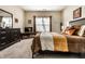 A cozy bedroom with carpet features a large bed, television, dresser, and a window at 10917 Hunter Lake Ln, Indianapolis, IN 46239