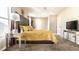 Stylish bedroom with contemporary decor, including a mirrored side table and a large TV at 10917 Hunter Lake Ln, Indianapolis, IN 46239