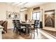 Elegant dining room featuring modern lighting, stylish artwork, and a well-coordinated table setting at 10917 Hunter Lake Ln, Indianapolis, IN 46239