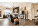 Comfortable living room with a fireplace, plush seating, modern lighting, and stylish decor at 10917 Hunter Lake Ln, Indianapolis, IN 46239
