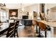A living room shows dark wood floors, a large television, and an open view to the kitchen at 10917 Hunter Lake Ln, Indianapolis, IN 46239