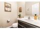 Neat powder room featuring a modern vanity, decorative accents, and essential fixtures at 10917 Hunter Lake Ln, Indianapolis, IN 46239