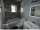 Clean bathroom with bathtub, toilet, and vanity at 1459 W 33Rd St, Indianapolis, IN 46208