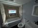 Updated bathroom with tub, toilet and vanity at 1459 W 33Rd St, Indianapolis, IN 46208