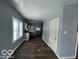 Dining area with kitchen and wood-look floors at 1459 W 33Rd St, Indianapolis, IN 46208