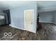 Dining area with kitchen and wood-look floors at 1459 W 33Rd St, Indianapolis, IN 46208