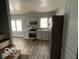 Modern kitchen featuring stainless steel appliances and wood-look floors at 1459 W 33Rd St, Indianapolis, IN 46208
