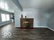 Living room with fireplace and wood-look floors at 1459 W 33Rd St, Indianapolis, IN 46208
