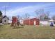 Spacious backyard with shed, garage, and playset at 1743 Sparrow Ave, Indianapolis, IN 46227