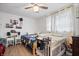 Bright bedroom with two beds, ceiling fan, and window coverings at 1743 Sparrow Ave, Indianapolis, IN 46227