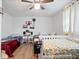 Cozy bedroom featuring two beds, ceiling fan, and ample natural light at 1743 Sparrow Ave, Indianapolis, IN 46227