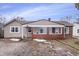 Cute ranch home features a covered porch and brick facade at 1743 Sparrow Ave, Indianapolis, IN 46227