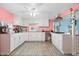 Eat-in kitchen with white cabinets, granite countertops, and tile floors at 1743 Sparrow Ave, Indianapolis, IN 46227