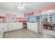 Bright kitchen features white cabinets, granite countertops, and an island at 1743 Sparrow Ave, Indianapolis, IN 46227