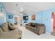Bright living room with light blue walls and comfy sofas at 1743 Sparrow Ave, Indianapolis, IN 46227