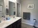 Bathroom featuring a double sink vanity, decorative artwork and neutral paint at 19438 Astoria Ave, Sheridan, IN 46069