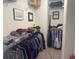 Organized walk-in closet featuring shelving, rods for hanging clothes, and neutral carpeting at 19438 Astoria Ave, Sheridan, IN 46069