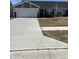 Charming single-story home with a well-maintained lawn and concrete driveway leading to a two-car garage at 19438 Astoria Ave, Sheridan, IN 46069