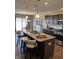 Eat-in kitchen featuring granite countertops, stainless steel appliances, and a large island with pendant lighting at 19438 Astoria Ave, Sheridan, IN 46069