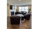 Comfortable living room featuring a fireplace and large windows at 19438 Astoria Ave, Sheridan, IN 46069