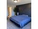 Main bedroom with a large bed and decorative accent wall at 19438 Astoria Ave, Sheridan, IN 46069