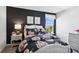 Bedroom with dark-colored walls and floral bedding at 19723 Atwater Ave, Sheridan, IN 46069