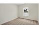 Simple bedroom with carpet and a large window at 19723 Atwater Ave, Sheridan, IN 46069