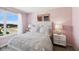Charming bedroom with pink walls and white bedding at 19723 Atwater Ave, Sheridan, IN 46069
