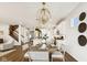 Open dining area with hardwood floors and view of kitchen and stairs at 19723 Atwater Ave, Sheridan, IN 46069