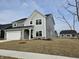 Charming two-story home with a gray exterior, attached garage, and a well-maintained lawn at 19723 Atwater Ave, Sheridan, IN 46069