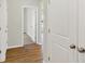 Hallway with hardwood floors and access to bedrooms at 19723 Atwater Ave, Sheridan, IN 46069