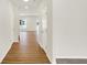 Light-filled hallway with hardwood floors and doors at 19723 Atwater Ave, Sheridan, IN 46069