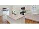 Modern kitchen features white cabinets, stainless steel appliances, and an island at 19723 Atwater Ave, Sheridan, IN 46069