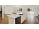 Modern kitchen with island, stainless steel appliances, hardwood floors at 19723 Atwater Ave, Sheridan, IN 46069