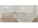 Upstairs loft area with neutral carpet and window at 19723 Atwater Ave, Sheridan, IN 46069