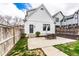 Back exterior of house with a concrete patio and detached garage, great for outdoor activities at 2301 Nowland Ave, Indianapolis, IN 46201
