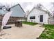 Backyard features concrete patio, a table with seating, and a detached garage at 2301 Nowland Ave, Indianapolis, IN 46201