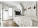 Bright bedroom with built-in shelving and TV at 2301 Nowland Ave, Indianapolis, IN 46201