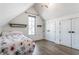 Bedroom with floral bedding and closet at 2301 Nowland Ave, Indianapolis, IN 46201